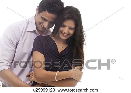 Couple embracing each other View Large Photo Image Stock Image - Couple embracing each other. Fotosearch