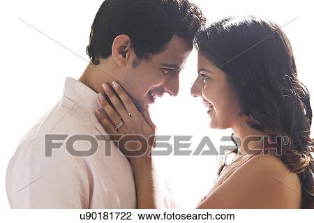 Stock Image - Couple embracing each other. Fotosearch