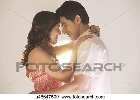 Couple embracing each other View Large Photo Image Stock Photo - Couple embracing each other. Fotosearch