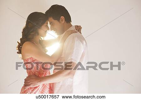 Couple embracing each other View Large Photo Image Stock Photo - Couple embracing each other. Fotosearch