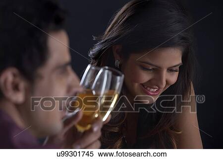 Couple enjoying a glass of wine on Valentines Day View Large Photo Image Stock Photography - Couple enjoying a glass of wine on Valentines Day. Fotosearch