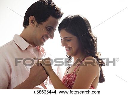 Picture - Couple holding each other. Fotosearch