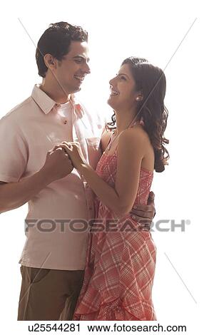 Stock Image - Couple holding each other. Fotosearch
