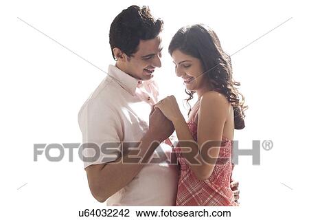 Stock Image - Couple holding each other. Fotosearch