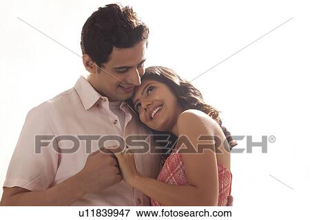 Stock Photo - Couple holding each other. Fotosearch
