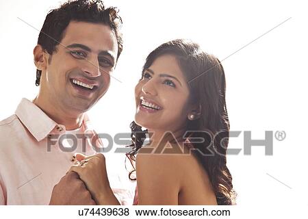 Couple holding each other View Large Photo Image Stock Photo - Couple holding each other. Fotosearch