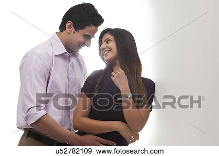 Couple looking at each other View Large Photo Image Stock Photo - Couple looking at each other. Fotosearch