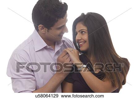 Couple looking at each other View Large Photo Image Stock Photo - Couple looking at each other. Fotosearch