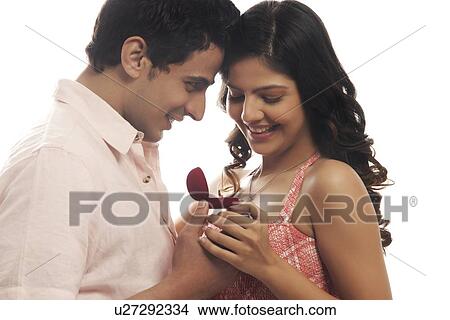 Couple looking at engagement ring View Large Photo Image Picture - Couple looking at engagement ring. Fotosearch