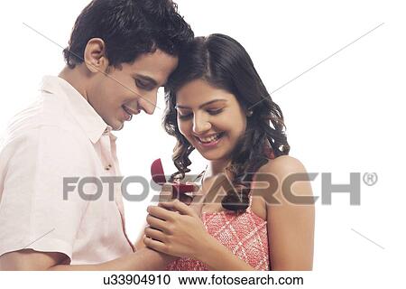 Couple looking at engagement ring View Large Photo Image Stock Image - Couple looking at engagement ring. Fotosearch