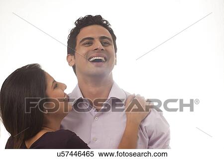 Stock Photography - Couple with a rose laughing. Fotosearch