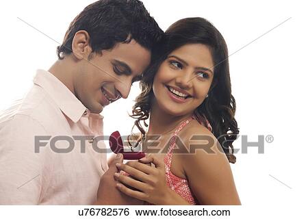 Couple with engagement ring View Large Photo Image Stock Photograph - Couple with engagement ring. Fotosearch