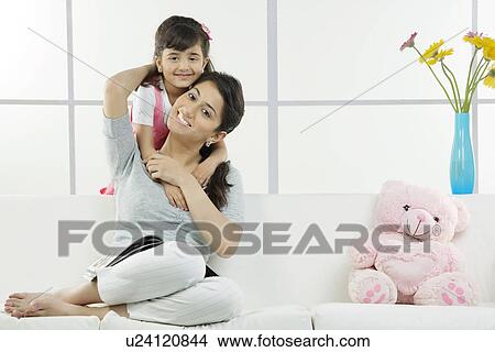 Daughter hugging her mother View Large Photo Image Picture - Daughter hugging her mother . Fotosearch
