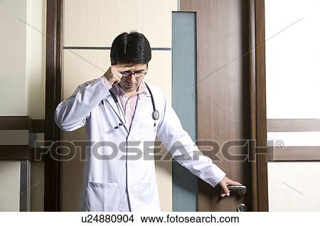 Picture - Doctor in deep thought . Fotosearch