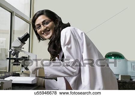 Doctor with a microscope View Large Photo Image Stock Photo - Doctor with a microscope . Fotosearch