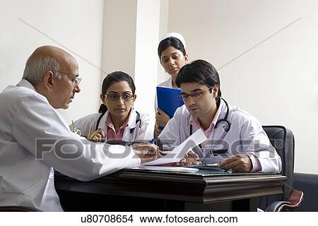 Doctors having a discussion View Large Photo Image Picture - Doctors having a discussion . Fotosearch