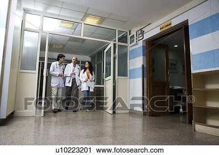 Stock Image - Doctors having a discussion . Fotosearch