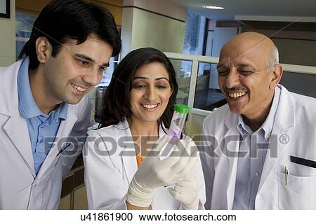 Stock Image - Doctors looking at a sample . Fotosearch