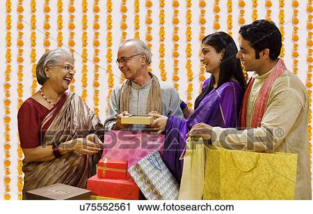 Family with Diwali gifts View Large Photo Image Stock Image - Family with Diwali gifts . Fotosearch