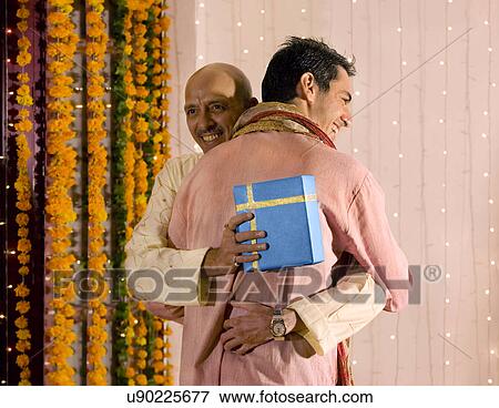 Father and son hugging each other View Large Photo Image Stock Photo - Father and son hugging each other . Fotosearch