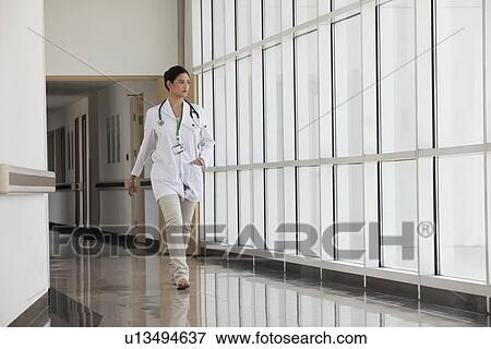 Female doctor walking View Large Photo Image Stock Photo - Female doctor walking. Fotosearch