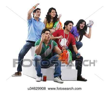 Stock Photo - Friends watching a cricket match and reacting . Fotosearch