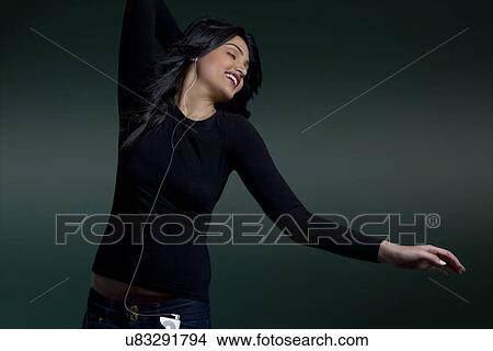 Girl listening to music View Large Photo Image Picture - Girl listening to music . Fotosearch