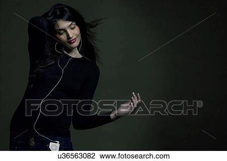 Girl listening to music View Large Photo Image Stock Image - Girl listening to music . Fotosearch