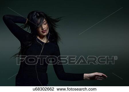 Girl listening to music View Large Photo Image Stock Image - Girl listening to music . Fotosearch