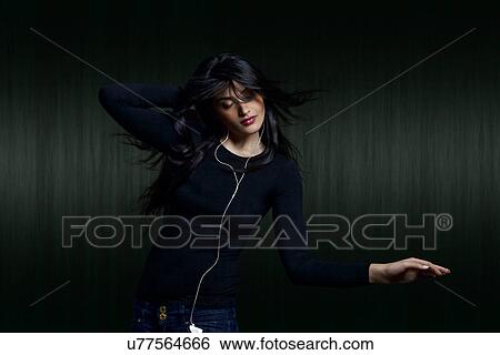 Girl listening to music View Large Photo Image Stock Photograph - Girl listening to music . Fotosearch