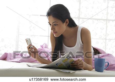 Stock Photo - Girl reading an sms . Fotosearch