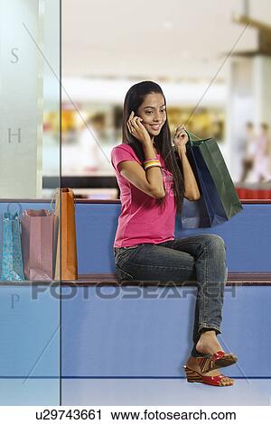 Girl talking on a mobile phone View Large Photo Image Stock Image - Girl talking on a mobile phone . Fotosearch