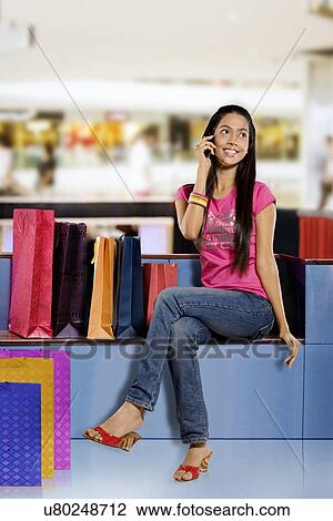 Girl talking on a mobile phone View Large Photo Image Stock Image - Girl talking on a mobile phone . Fotosearch