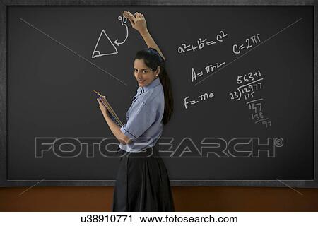 Girl writing on a blackboard View Large Photo Image Stock Image - Girl writing on a blackboard . Fotosearch