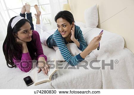 Stock Image - Girls enjoying their space . Fotosearch