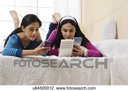 Girls in their own space View Large Photo Image Stock Image - Girls in their own space . Fotosearch