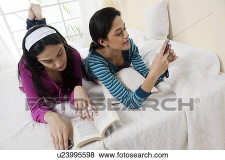 Stock Photo - Girls in their own space . Fotosearch