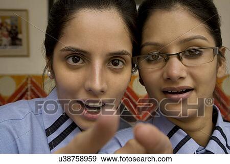 Stock Photo - Girls pointing . Fotosearch