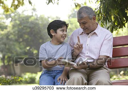 Grandfather explaining to his grandson View Large Photo Image Stock Image - Grandfather explaining to his grandson. Fotosearch