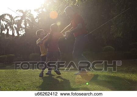 Grandfather playing with his grandchildren View Large Photo Image Stock Image - Grandfather playing with his grandchildren. Fotosearch