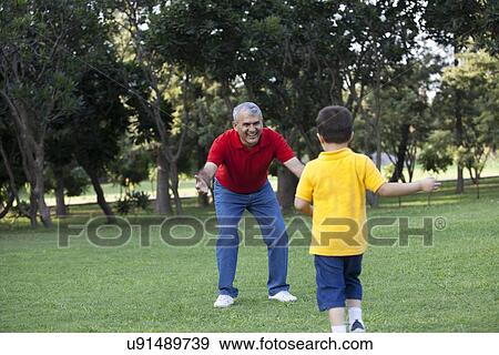 Grandson running towards grandfather View Large Photo Image Stock Photo - Grandson running towards grandfather. Fotosearch