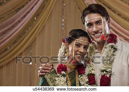 Happy bride and groom smiling together View Large Photo Image Stock Photo - Happy bride and groom smiling together . Fotosearch