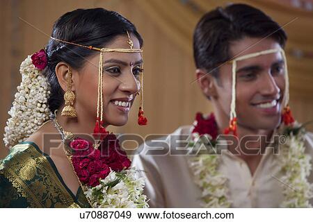 Stock Photo - Happy married couple smiling together . Fotosearch