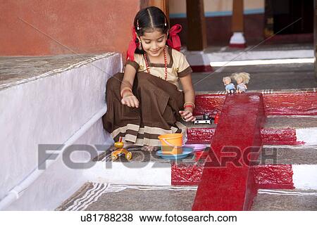 Little girl playing with her toys View Large Photo Image Stock Photo - Little girl playing with her toys . Fotosearch
