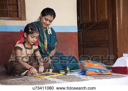 Little girl studying View Large Photo Image Stock Image - Little girl studying . Fotosearch