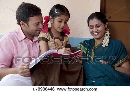 Little girl with a colouring book View Large Photo Image Stock Photograph - Little girl with a colouring book . Fotosearch