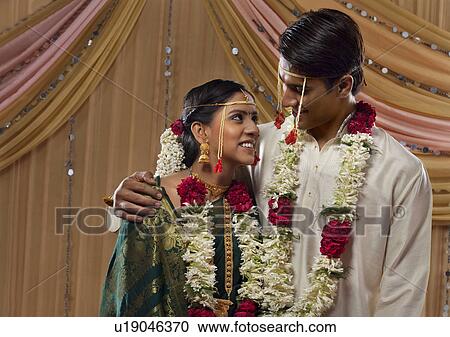 Loving Maharashtrian bride and groom looking at each other View Large Photo Image Stock Image - Loving Maharashtrian bride and groom looking at each other . Fotosearch