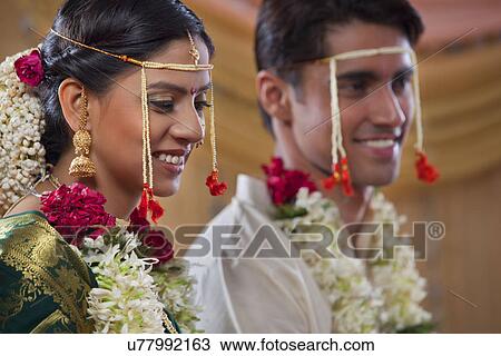 Stock Image - Maharashtrian bride and groom smiling together . Fotosearch