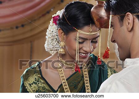 Maharashtrian bride and groom performing a ritual View Large Photo Image Stock Image - Maharashtrian bride and groom performing a ritual . Fotosearch