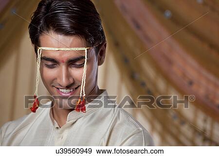 Stock Photo - Maharashtrian groom smiling . Fotosearch